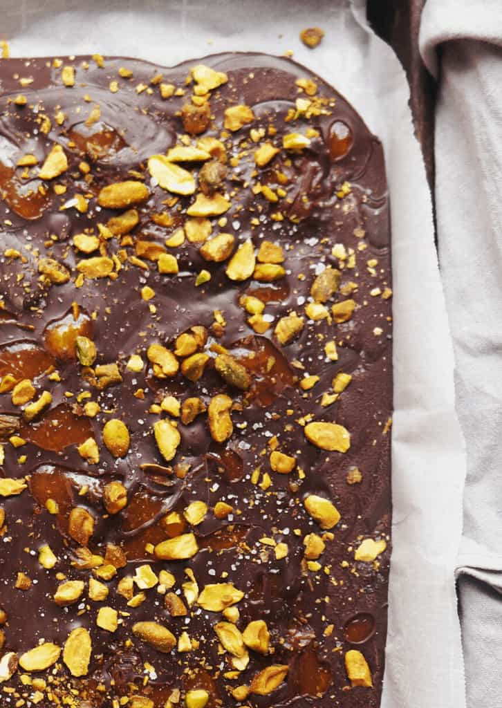 Keto Apricot and Pistachio Dark Chocolate Bark on parchment