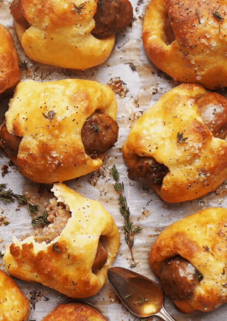 pretzels on a baking tray with herbs