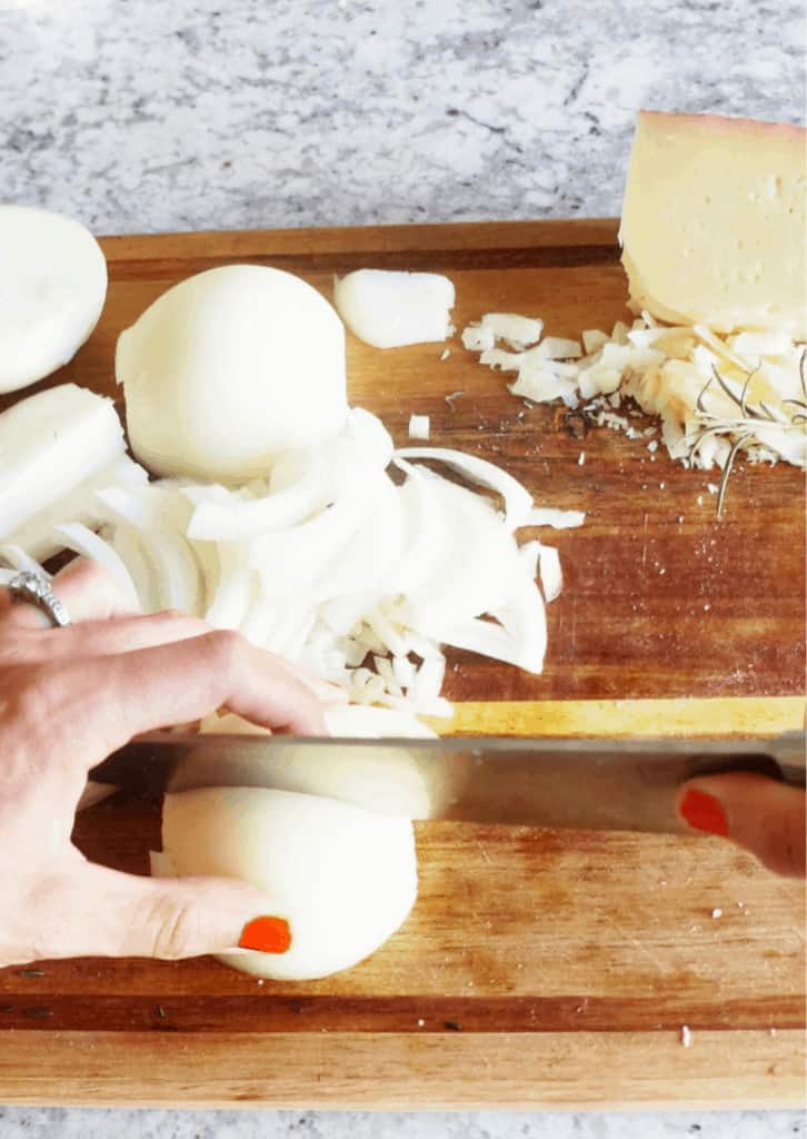 sliced onions on a cutting board