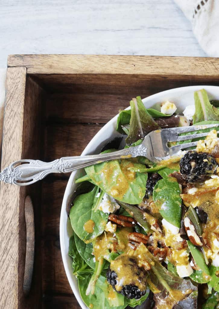 Keto Autumn Salad in a bowl on a wooden tray