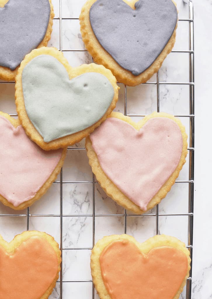 Keto Sugar Cookies shaped as hearts on a wire rack