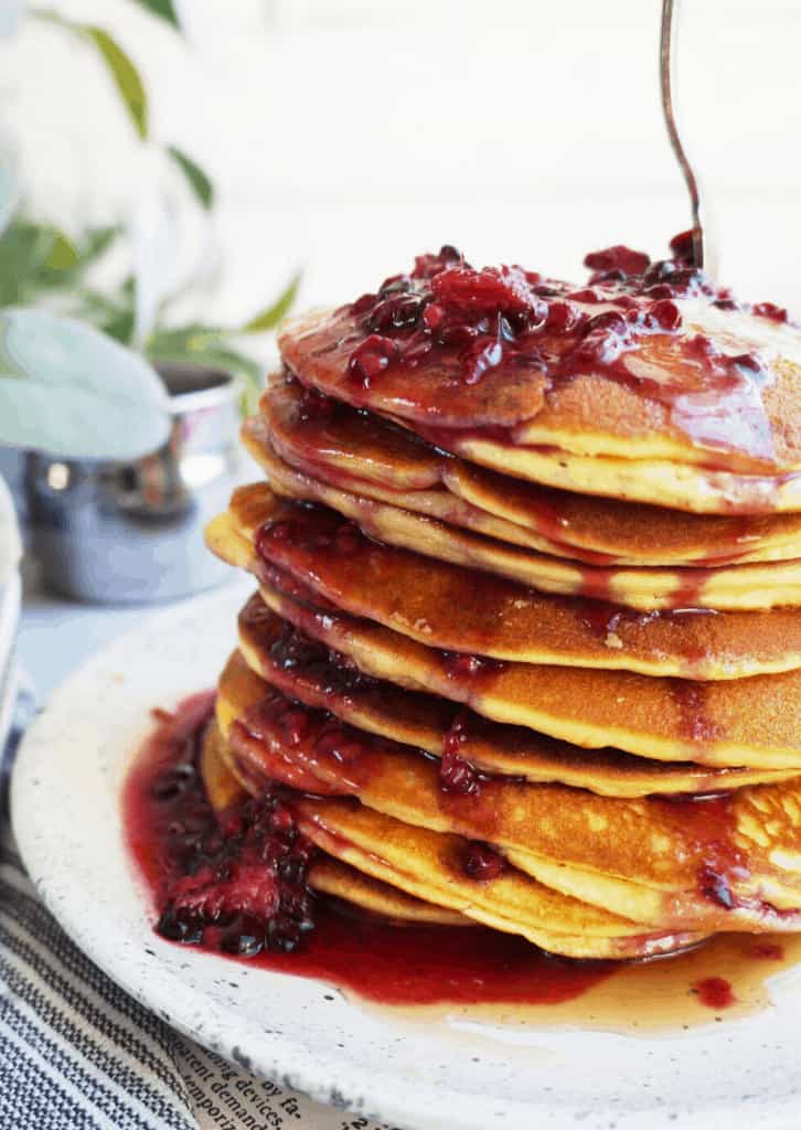 stack of keto pancakes with blackberry syrup
