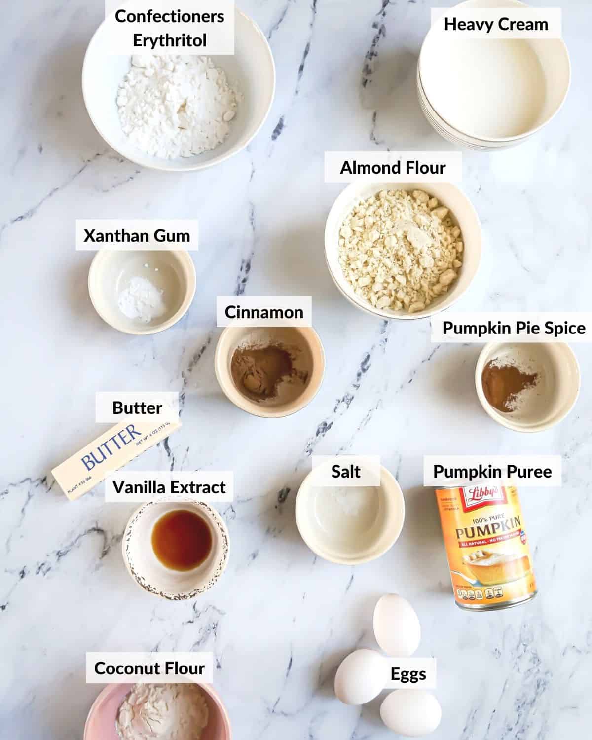 ingredients for pumpkin pie measured out onto marble counter
